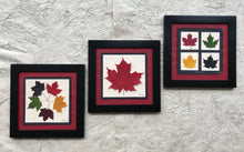 dried maple leaf framed artwork with black frame and red handmade paper