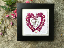 Real pressed Bleeding Heart flowers arranged in the shape of a heart in a black lacquered solid wood frame. Handmade in Canada by Pressed Wishes.  