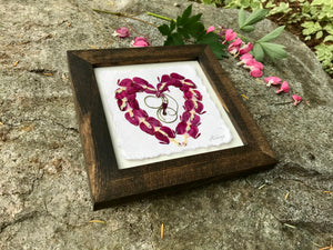 Real pressed Bleeding Heart flowers arranged in the shape of a heart in a walnut stained solid wood frame. Handmade in Canada by Pressed Wishes.