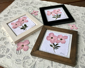 Pink dogwood flowers are pressed and turned into minimalistic wall art by Pressed Wishes. 