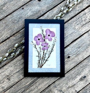 Real pressed purple dogwood flowers, pussy willow and musk mallow are arranged in a bouquet and framed with a solid wood handcrafted frame. Handmade by botanical artist Pressed Wishes.