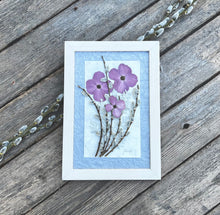 Real pressed purple dogwood flowers, pussy willow and musk mallow are arranged in a bouquet and framed with a solid wood handcrafted frame. Handmade by botanical artist Pressed Wishes.