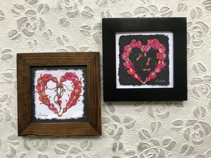 Dried flower art - pressed bleeding heart floral art in heart formation; available in black and walnut frame