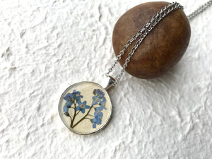 pressed forget me not necklace in silver pendant