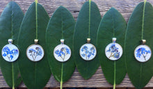pressed forget me not in eco resin. available in silver and bronze