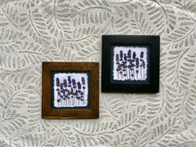 pressed lavender framed picture with black and walnut frame
